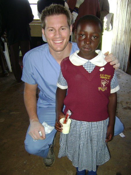 Dr. Steinbicker with a little girl from Kenya during a mission trip.