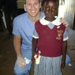 Dr. Steinbicker with a little girl from Kenya during a mission trip.