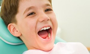 Little boy in the dental chair.